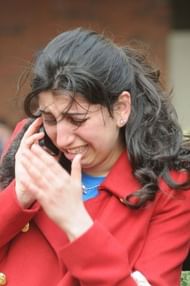A woman reacts after explosions rocked the finish area of the Boston Marathon on April 15, 2013 in Boston, Massachusetts
